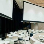 Corporate meeting in Tacoma with screens and cameras planned by Olivia Sloan Events