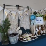 Horse-themed birthday party decorations and cupcakes with a rustic barn backdrop Gold 2 second birthday
