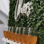 Cheers beverage wall custom drink "Cheers" signage at birthday party by tacoma event planner