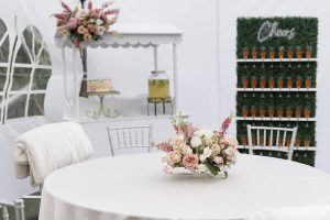 Feminine floral design with custom drink wall and cake cart at 18th birthday party in Tacoma.