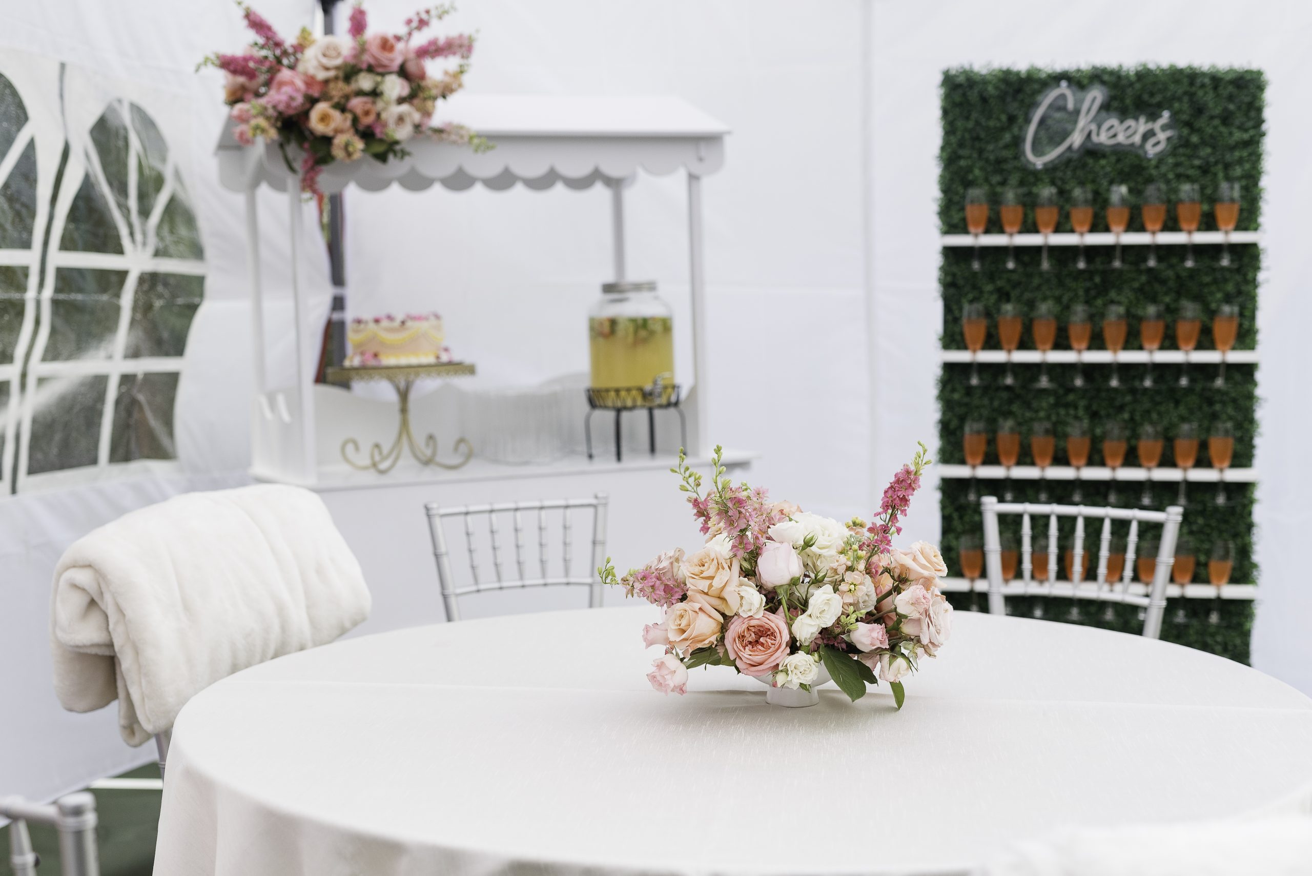 Feminine floral design with custom drink wall and cake cart at 18th birthday party in Tacoma.