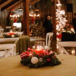Vintage Christmas party décor at The Kelley Farm, featuring velvet green linens, candles, and festive holiday accents.