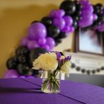 graduation party planner purple and black design florals and balloons tacoma wa