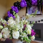 graduation party planner purple and black design beautiful florals and balloons tacoma wa